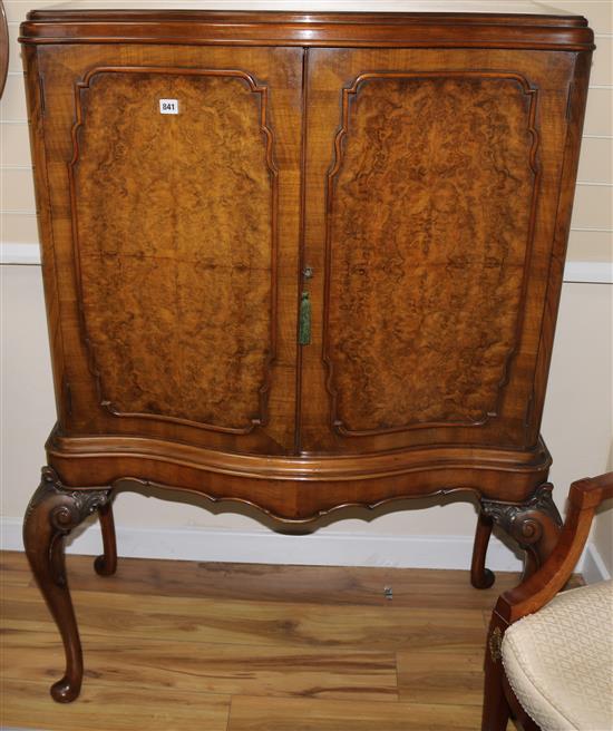 A Queen Anne revival serpentine walnut cabinet, W.106cm H.140cm